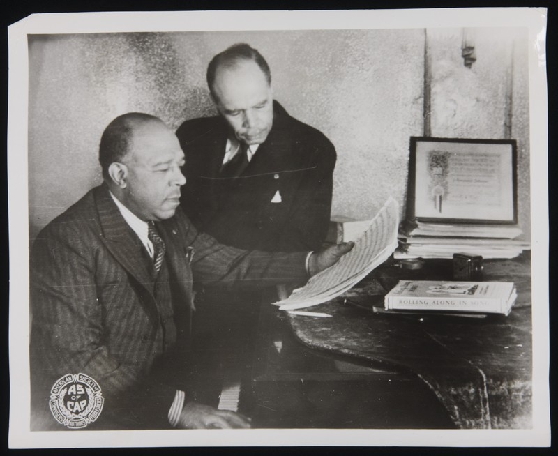 Photo of the Johnson brothers at a piano