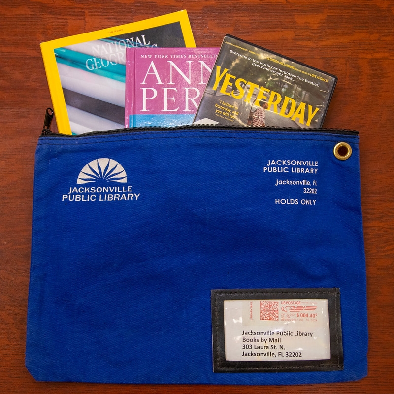 Books by Mail reusable nylon bag, with address card showing