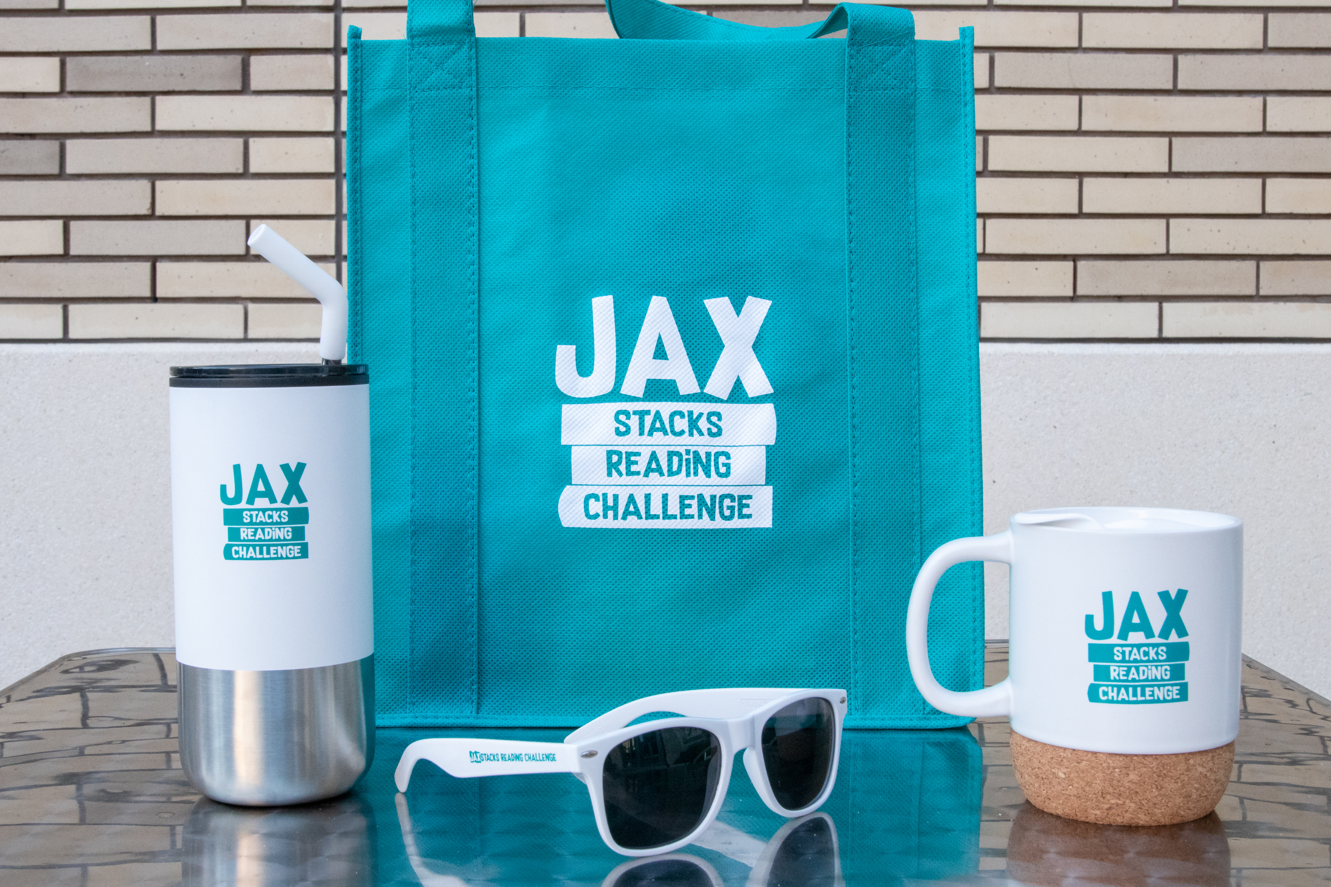 Jax Stacks branded tote, tumbler, sunglasses and mug