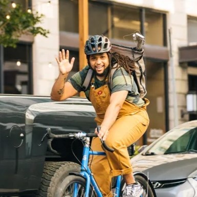 Mr. Joe riding a bike